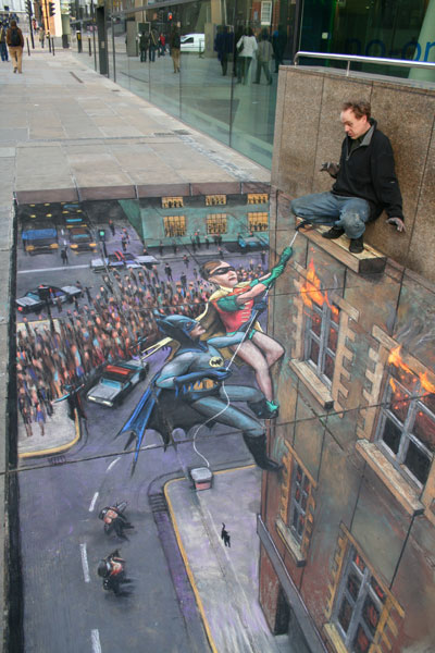 Batman and Robin to the rescue by Julien Beever.